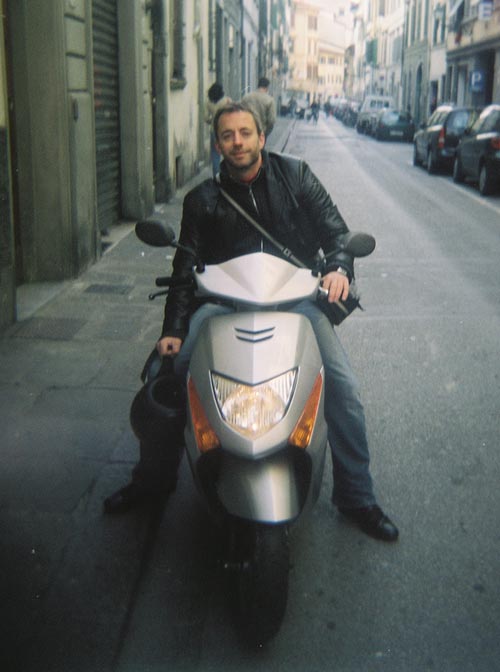 John McCalla on a scooter; Florence, Italy